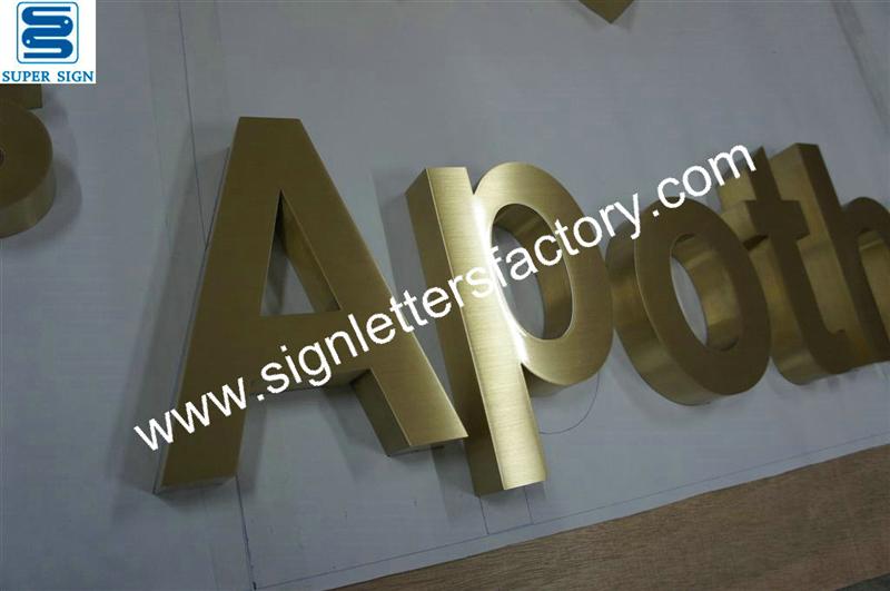 fabricated brushed brass sign lettering